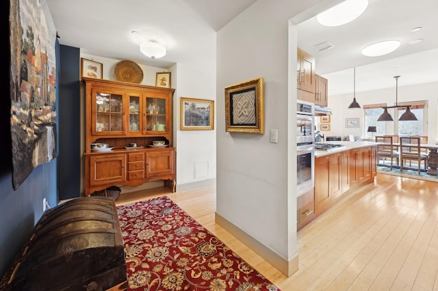 corridor featuring light hardwood / wood-style flooring