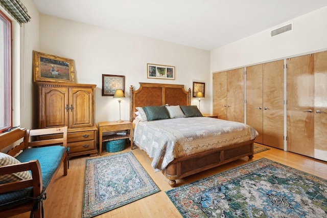 bedroom featuring a closet and light wood-type flooring