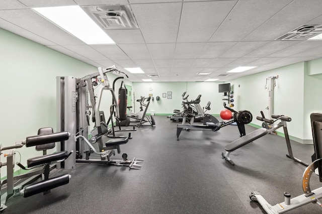 workout area featuring a paneled ceiling