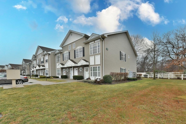 view of property exterior featuring a lawn