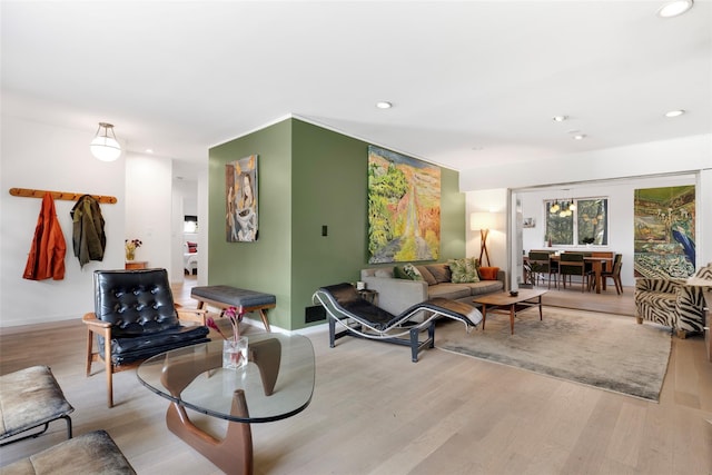 living area with recessed lighting, light wood-type flooring, and baseboards