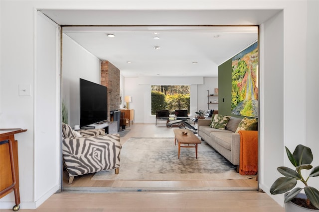 living room with recessed lighting and wood finished floors