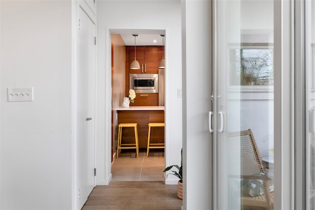 hallway with wood finished floors