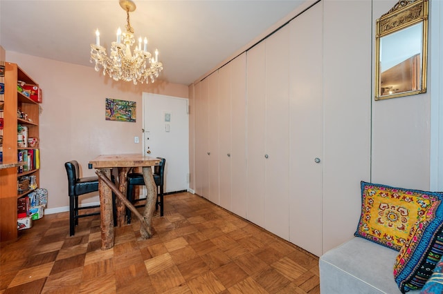 dining room featuring parquet floors and a notable chandelier