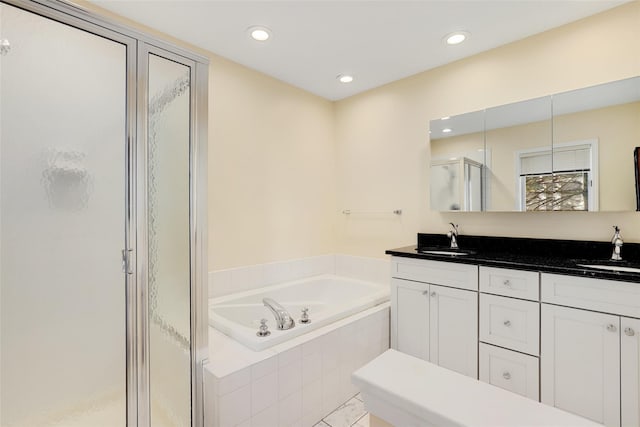 bathroom with vanity and plus walk in shower