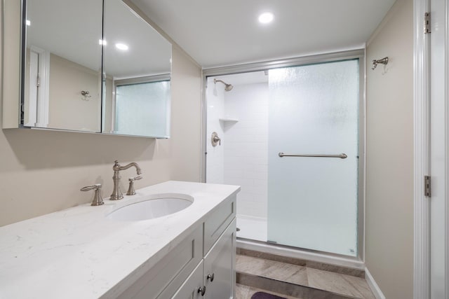 bathroom with vanity and an enclosed shower