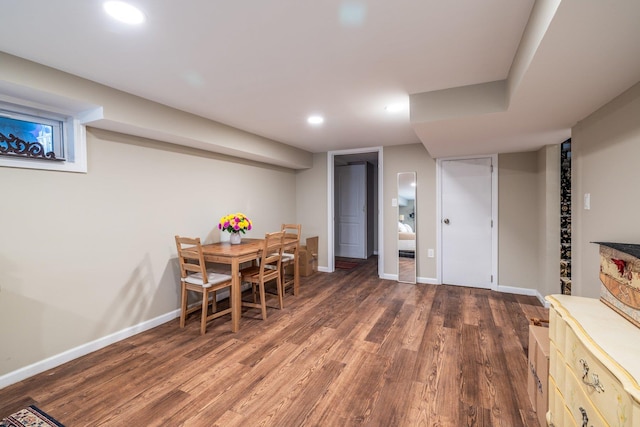 dining area featuring dark wood-type flooring