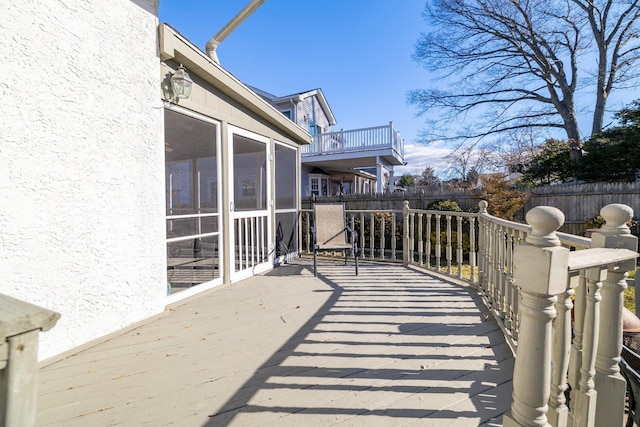 wooden terrace with a sunroom