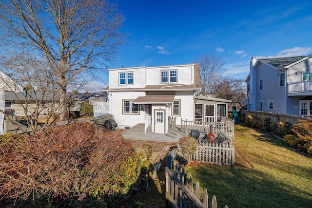 view of front of house with a patio area and a front lawn