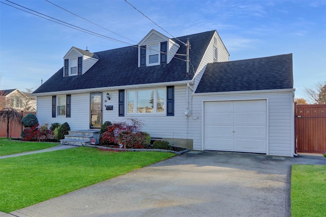 new england style home with a garage and a front yard