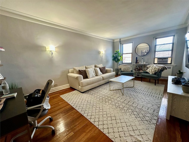 living room featuring cooling unit, dark wood-type flooring, and ornamental molding