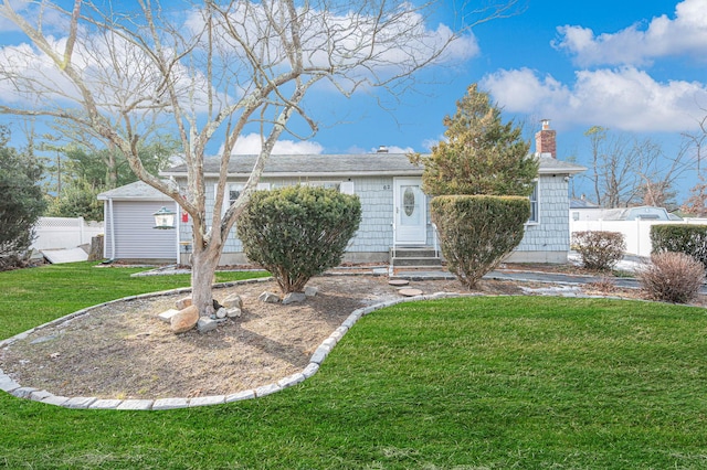 ranch-style house with a front lawn