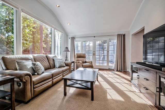 sunroom / solarium featuring lofted ceiling and french doors