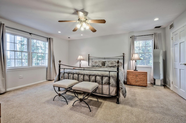 carpeted bedroom featuring ceiling fan