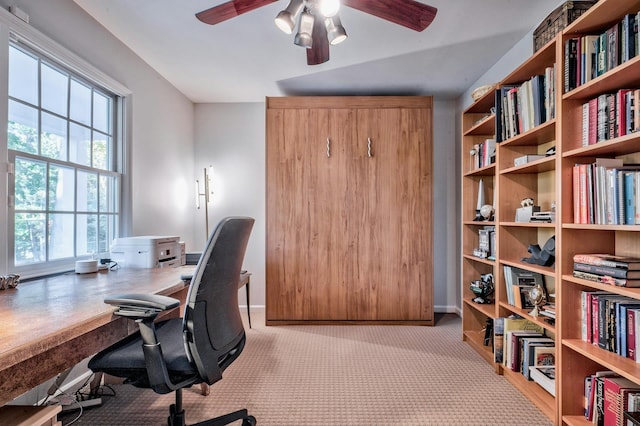 home office featuring ceiling fan and light colored carpet