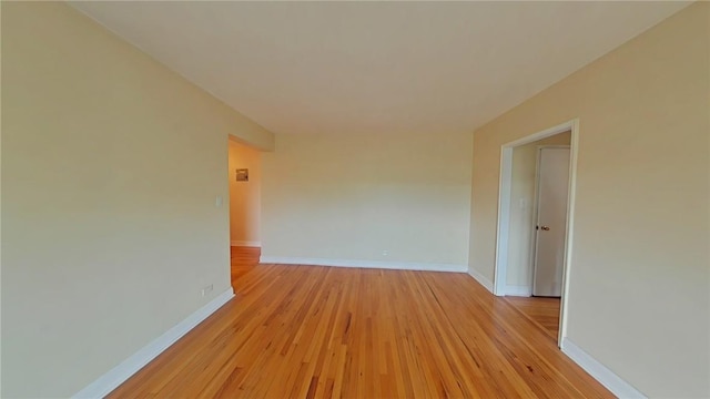 unfurnished room featuring light hardwood / wood-style floors