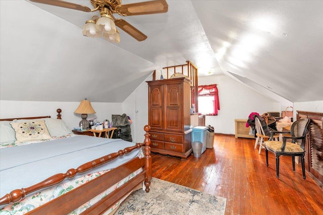 bedroom featuring wood-type flooring and vaulted ceiling