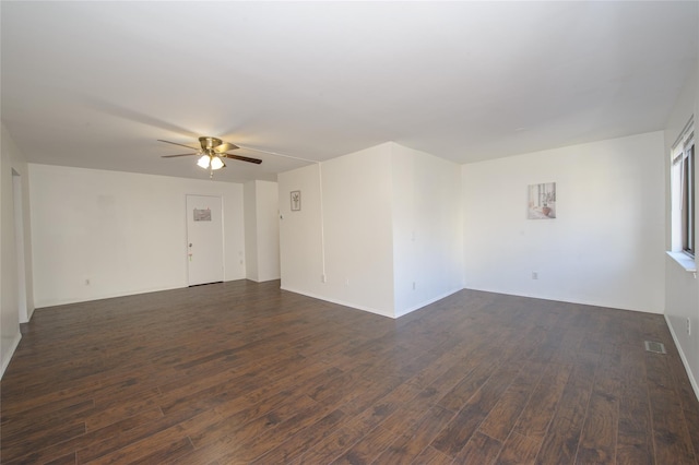 spare room with dark hardwood / wood-style floors and ceiling fan