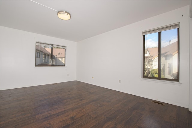 empty room featuring dark hardwood / wood-style floors