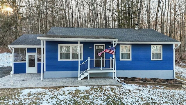 view of front of home featuring a sunroom