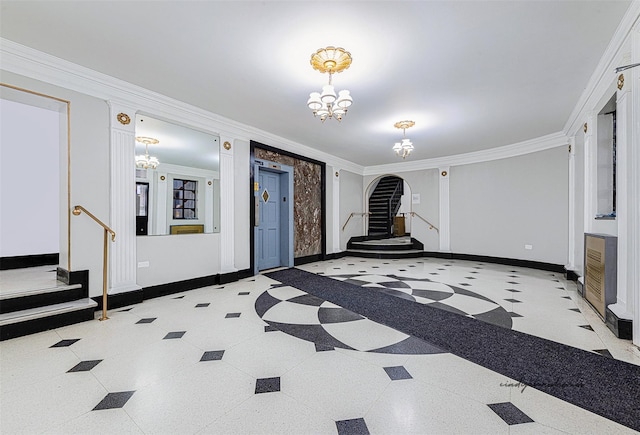 living room featuring crown molding and a notable chandelier