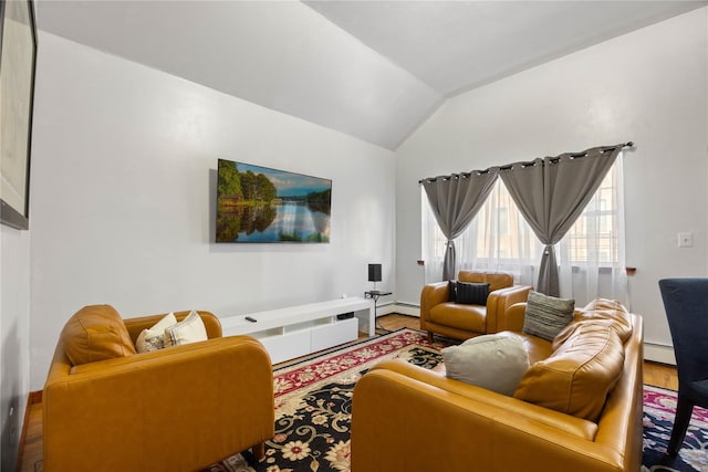 living room with lofted ceiling, hardwood / wood-style floors, and a baseboard radiator