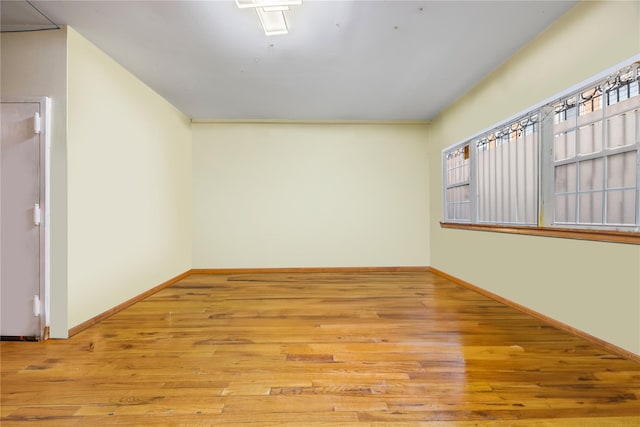 spare room featuring light hardwood / wood-style flooring