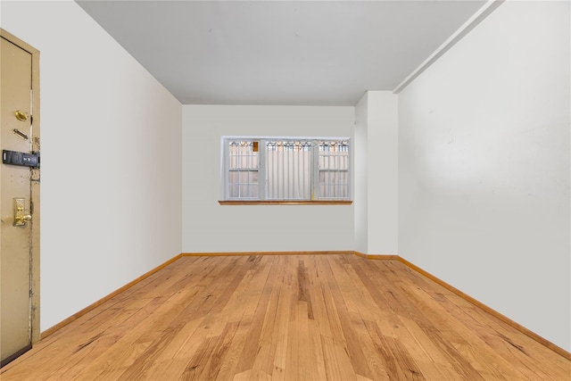 unfurnished room featuring light hardwood / wood-style floors