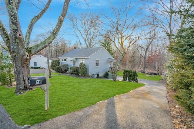 view of side of home featuring a yard