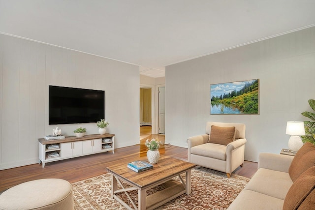 living room with hardwood / wood-style flooring and baseboard heating