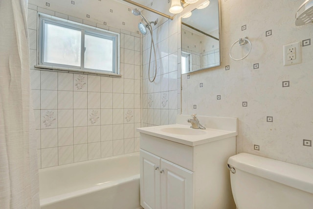 full bathroom featuring vanity, shower / bath combo with shower curtain, and toilet