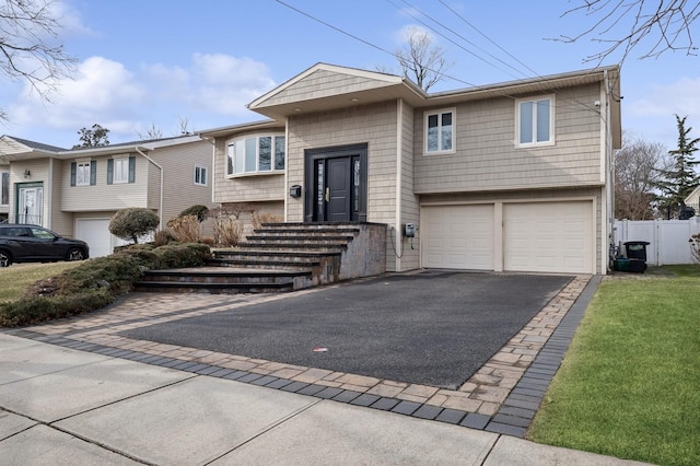 bi-level home featuring a garage