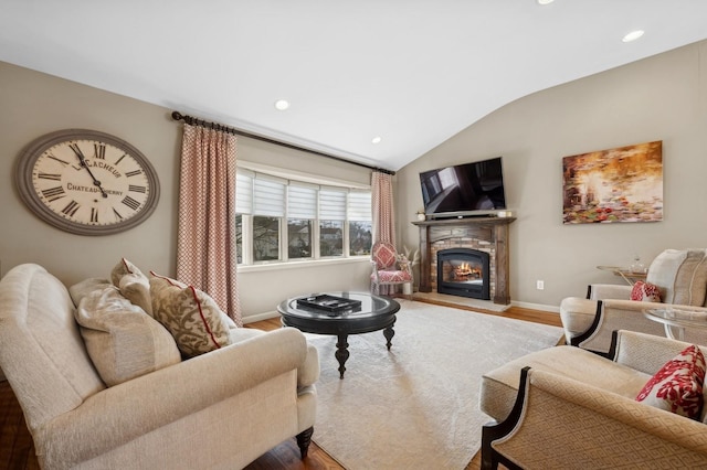 living room with hardwood / wood-style flooring and vaulted ceiling