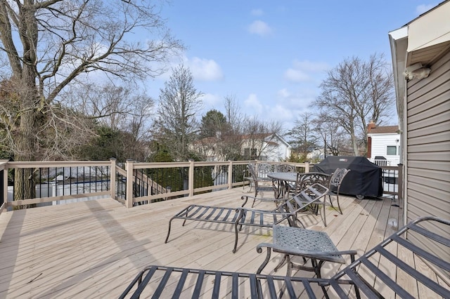 wooden deck featuring grilling area