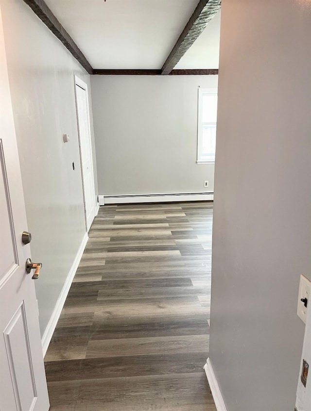 interior space featuring beamed ceiling, a baseboard radiator, and dark hardwood / wood-style flooring