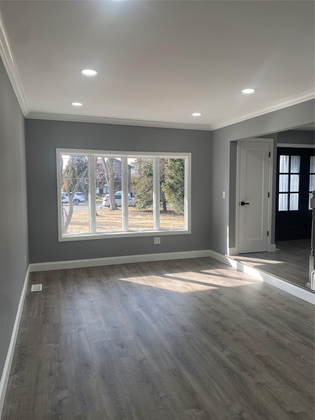 interior space with ornamental molding and dark hardwood / wood-style floors