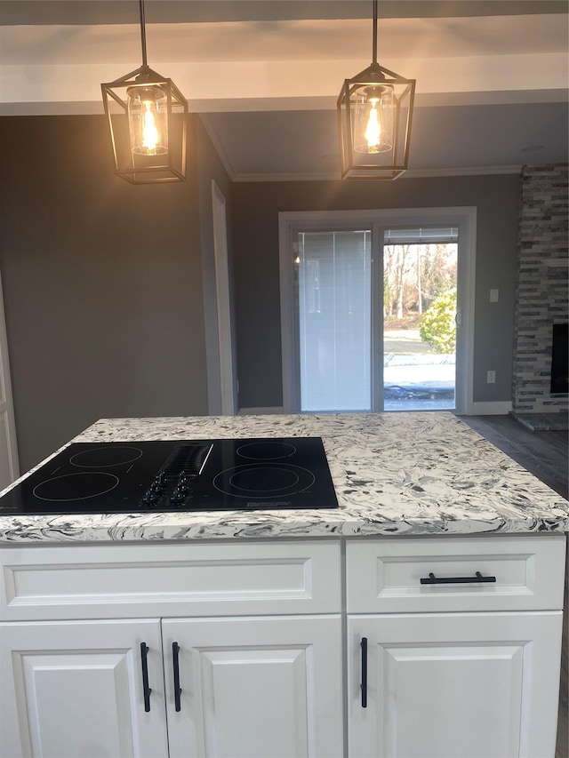 kitchen featuring white cabinets and decorative light fixtures