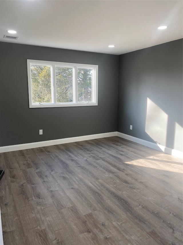 empty room featuring hardwood / wood-style flooring