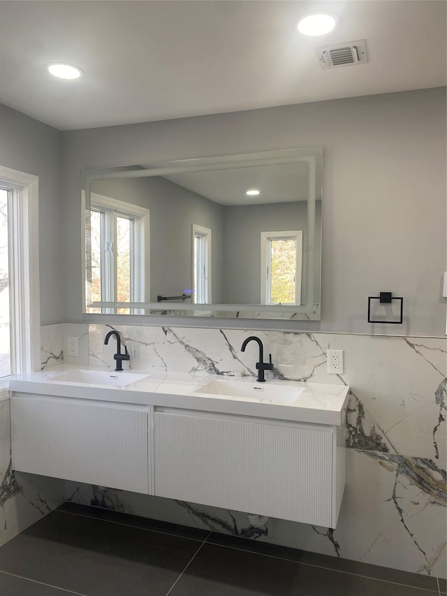 bathroom featuring vanity and a healthy amount of sunlight