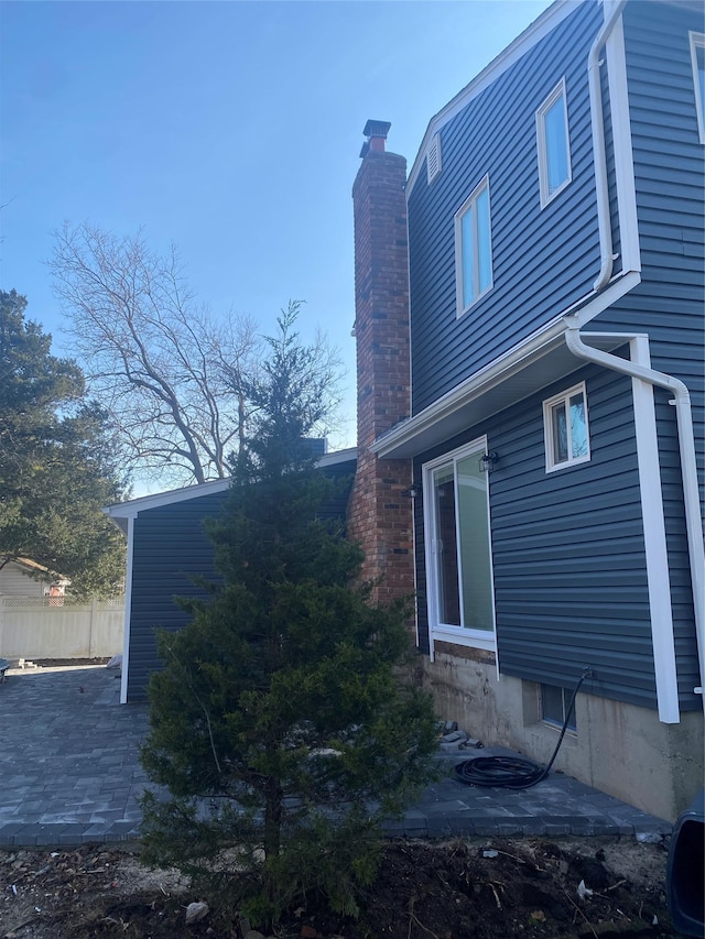 view of side of property with a patio area