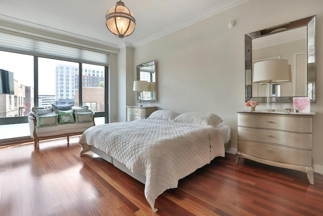 bedroom with crown molding and dark hardwood / wood-style flooring