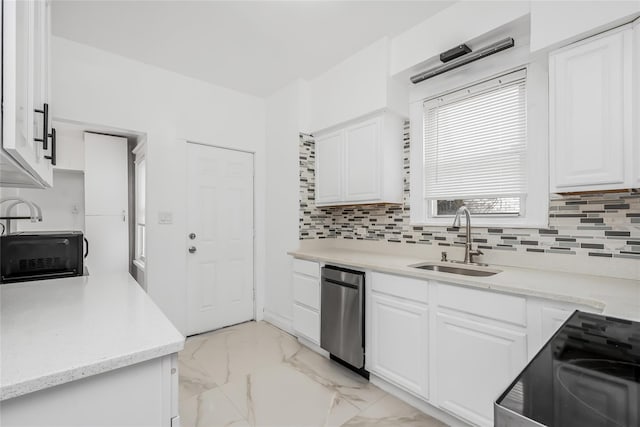 kitchen featuring sink, black / electric stove, stainless steel dishwasher, white cabinets, and backsplash