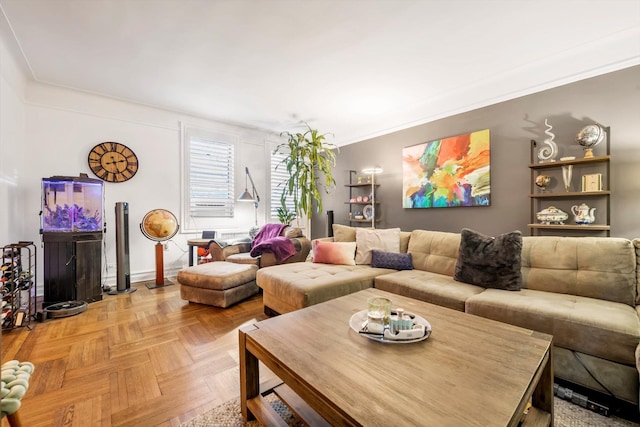 living room featuring crown molding and light parquet floors