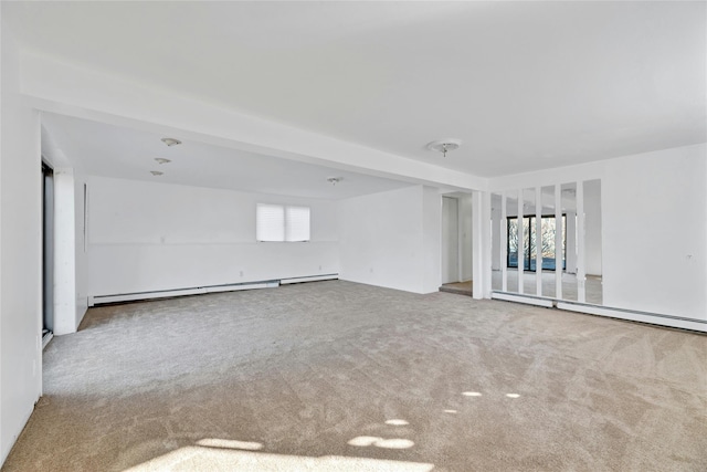 carpeted empty room with a baseboard radiator