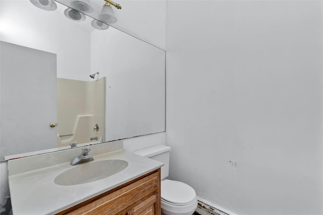 full bathroom featuring shower / tub combination, vanity, and toilet