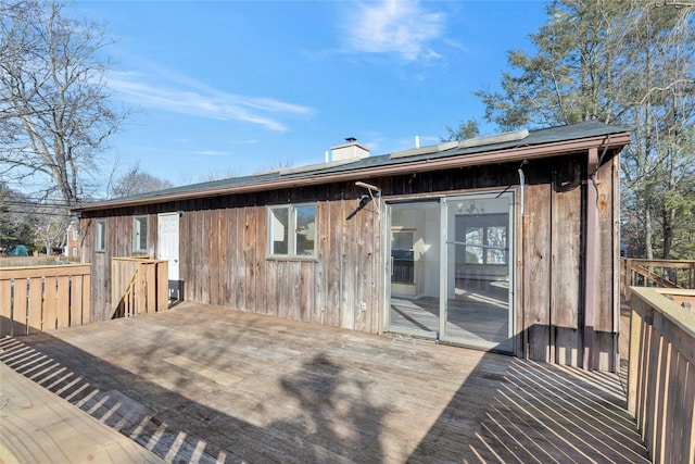 back of house with a wooden deck