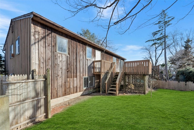 exterior space with a wooden deck and a yard