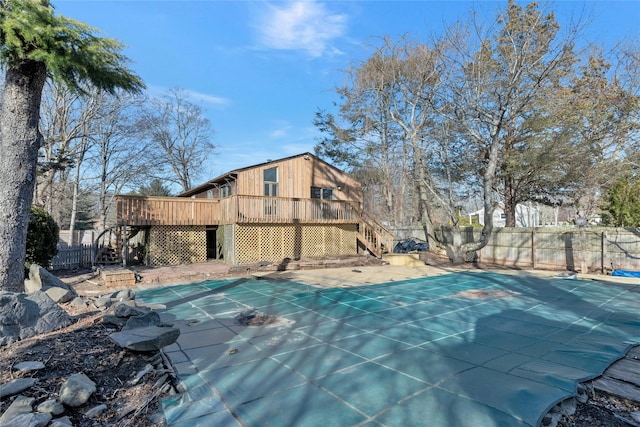 view of swimming pool with a wooden deck