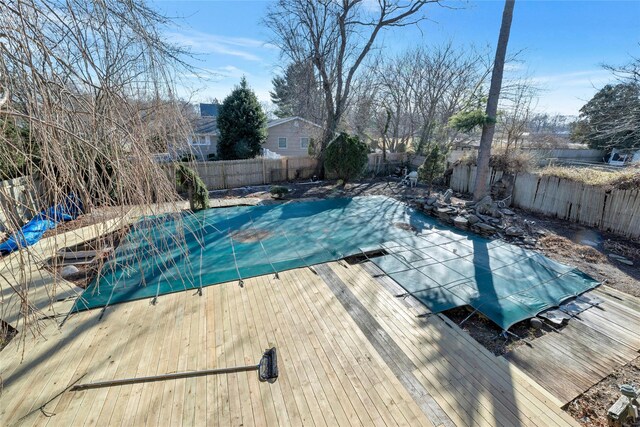 view of swimming pool featuring a deck