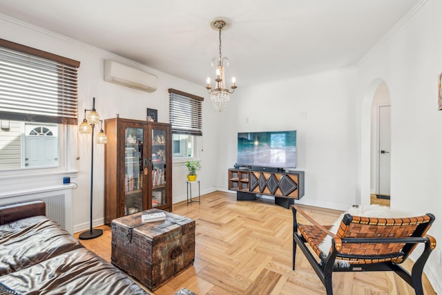 living room featuring light parquet floors, crown molding, a wall mounted air conditioner, and an inviting chandelier